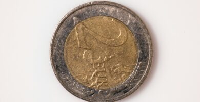 a close up of a coin on a white surface